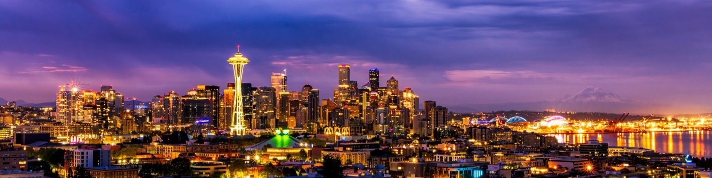 Seattle skyline at dusk with Space Needle and city lights – home of Agenturnal